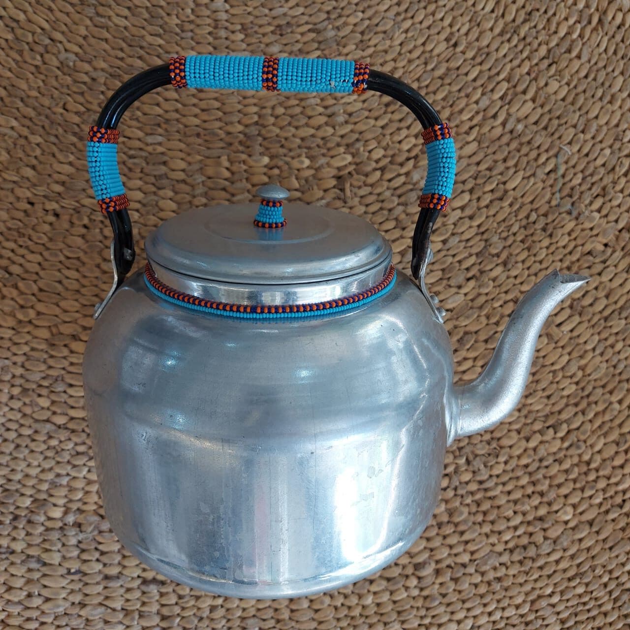 Teapot with beaded handle